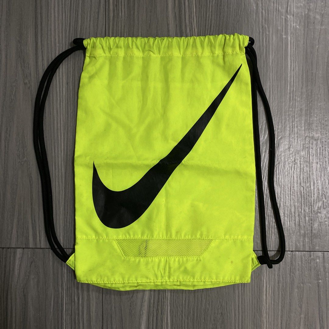 Nike Sack Bag - Neon Green (Category: Backpacks) located in Cainta. Submitted by barangaydrip (Listing ID 1424375283, Image 1). Description: - Nike drawstring bag - Neon green color - Large black Nike swoosh logo - Black drawstrings - Mesh bottom panel - Stylish and practical - Needs cleaning - Cainta area.