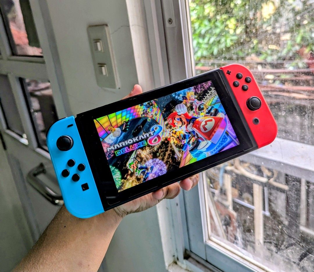 Nintendo Switch V1 with Free Games (Category: Nintendo) located in Manila. Submitted by nswitchgear (Listing ID 1424399562, Image 1). Description: For Sale 7,499 php Nintendo Switch V1 Neon RedBlue FREE acess to my Paid games Legit purchase not Jailbreak. Used item but as new condition Can give 7 Days personal Warranty for peace of mind. Comes w/ Dock ,Grips and type c cord only. Any of my Digital PAID Shared Games can be reinstalled for FREE dir