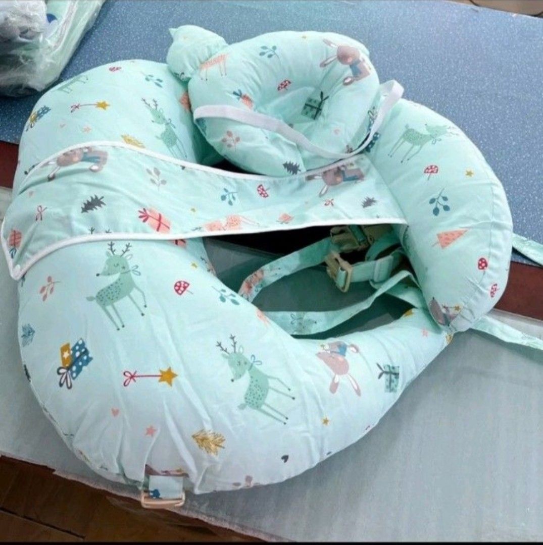 Nursing Pillow Set with Headrest and Guardrail (Category: Maternity Care) located in Paranaque City. Submitted by cyclone08_23 (Listing ID 1424441305, Image 3). Description: Nursing pillow set includes an independent liner, nursing pillow, baby headrest, and guardrail. It features a blue and white striped design with sea-themed patterns. The set comes with an auxiliary shoulder strap for added support. The small pillow's position is adjustable, s