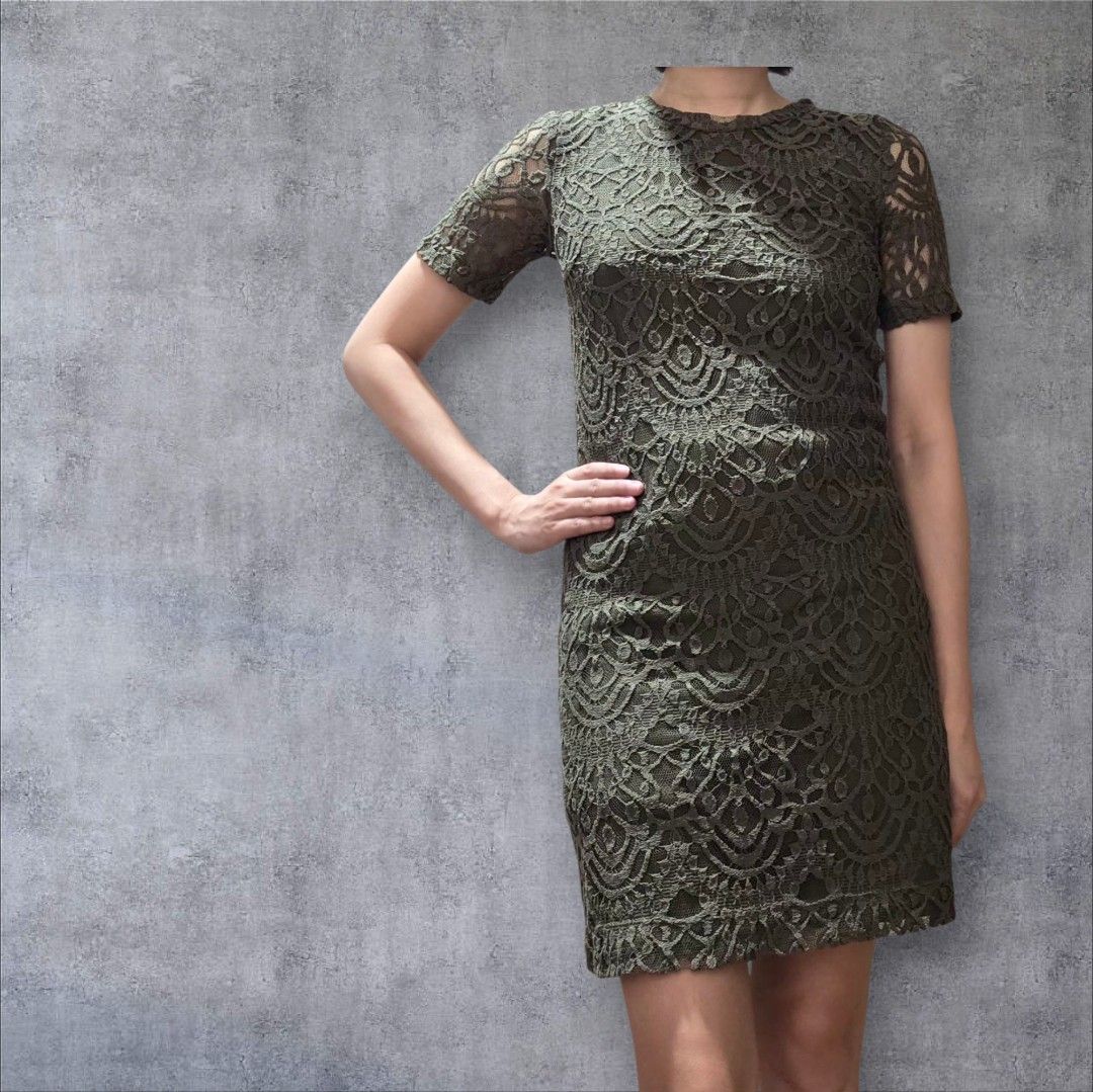 Olive Green Lace Dress (Category: Dresses) located in Quezon City. Submitted by highonspotlight (Listing ID 1424509401, Image 1). Description: - Elegant olive green lace dress - Features a round neckline - Short sleeves - Fitted silhouette - Falls to mid-thigh length - Perfect for special occasions or a night out - Intricate lace detailing.