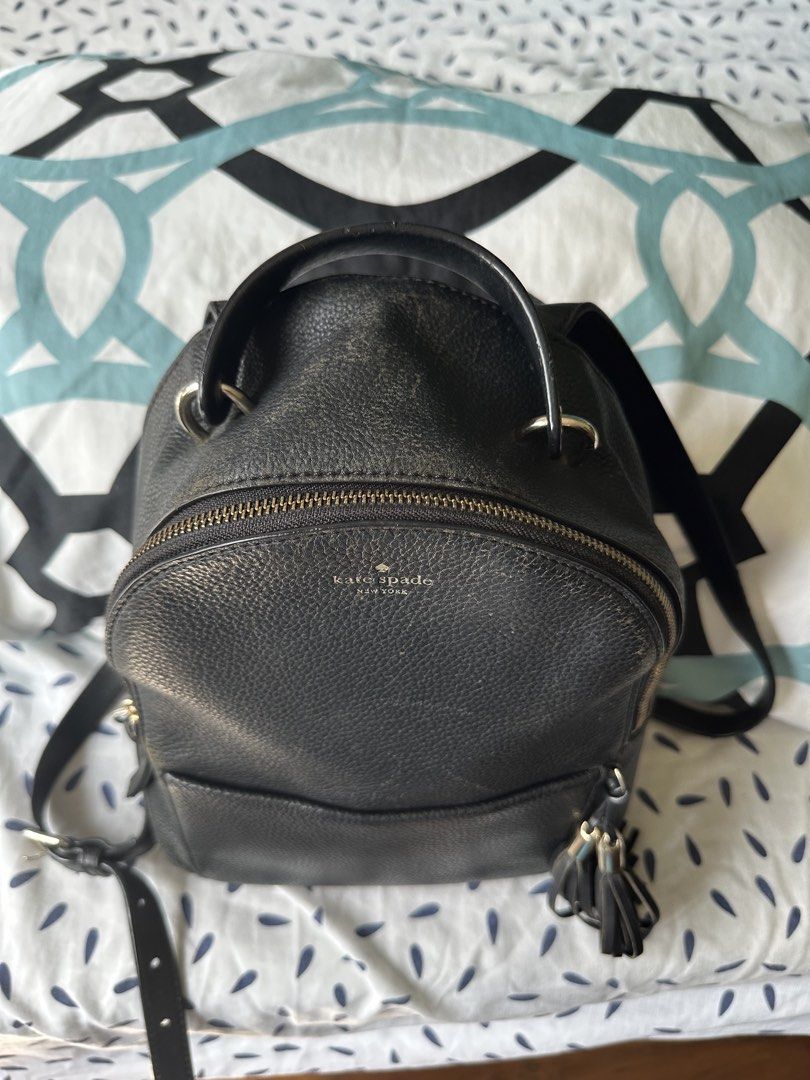 Original KATE SPADE backpack (Category: Luxury Bags & Wallets) located in Manila. Submitted by mershypus (Listing ID 1424489681, Image 2). Description: Kate Spade New York backpack in classic black. Used but still in good condition. Made of pebbled leather with gold-tone hardware and tassel zipper detail. Details: • 100% original Kate Spade • Used (may show light signs of use) • Zipper closure • Adjustable straps.