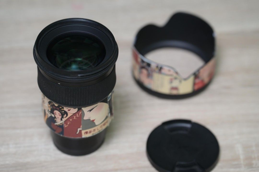 SIGMA ART 50MM 1.4 DG E-MOUNT (Category: Cameras) located in Makati City. Submitted by zygph (Listing ID 1424516902, Image 3). Description: - Sigma lens with unique custom skin. - Includes lens, lens hood, and lens cap. - Ready for immediate use. - Perfect for photographers..