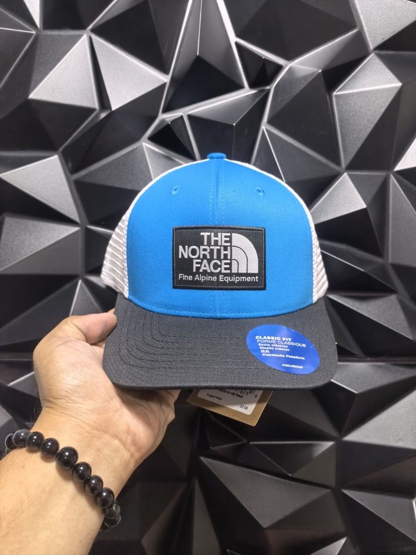 The North Face Classic Fit Trucker Cap (Category: Caps & Hats) located in Bacoor. Submitted by secretsup (Listing ID 1424456493, Image 1). Description: North Face Classic Fit Trucker Cap. Features a classic trucker design with a mesh back for breathability. The front panel displays The North Face logo. Available in multiple colors. Includes the original tag..
