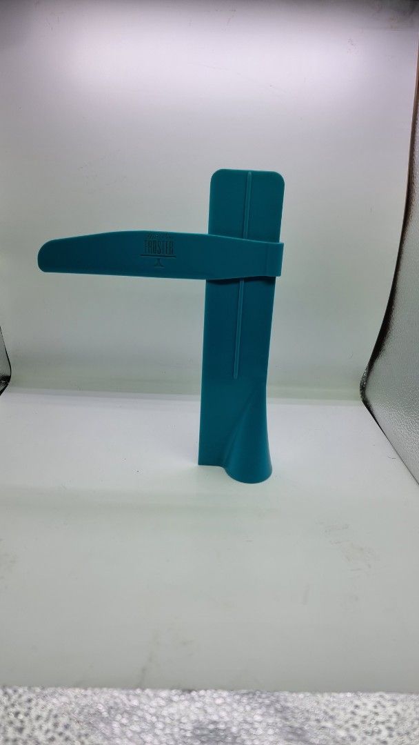 The Pro Froster Frosting Tool (Category: Bakeware) located in Marikina City. Submitted by andreah_16 (Listing ID 1424342389, Image 2). Description: - The Pro Froster: Your key to flawless frosting! - Teal-colored frosting tool. - Unique curved design for easy handling. - Durable plastic construction. - Features small holes for even frosting application. - Perfect for applying frosting and similar substances..