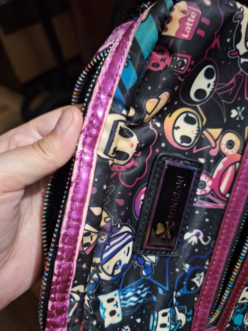 Tokidoki galaxy sling bag (Category: Cross-body Bags) located in Manila. Submitted by cassandruhh (Listing ID 1424390475, Image 3). Description: Authentic tokidoki sling/body bag - galaxy design - honest issue: slight flaking sa lining ( see last 2 photos) mop: gcash shipping: lalamove, gogoxpress only.
