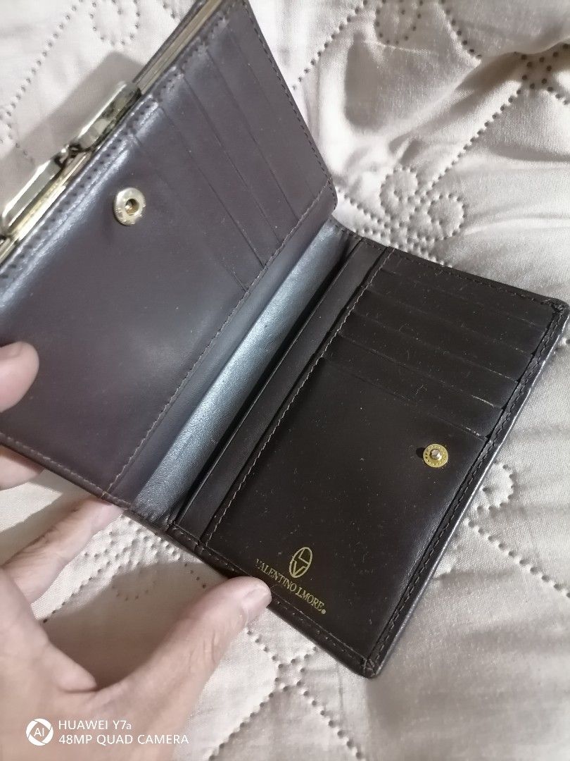 Valentino Lmore Brown Wallet (Category: Luxury Bags & Wallets) located in Naga. Submitted by mrwisethrifter (Listing ID 1424384858, Image 2). Description: - Valentino Morelli brown wallet - Woven exterior - Clasp closure - Multiple card slots - Bill and coin compartments - Valentino Morelli logo inside.