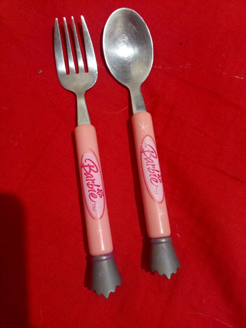 Vintage Barbie Spoon and Fork Set (Category: Dinnerware & Cutlery) located in Marikina City. Submitted by picker_seller17 (Listing ID 1424346094, Image 1). Description: - Barbie spoon and fork set - Pink handles with Barbie logo - Gray handle bottoms - Made of metal - Ideal for Barbie enthusiasts.