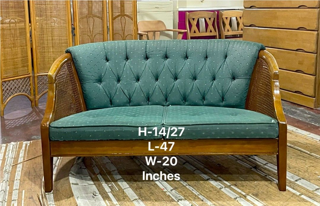 Vintage Teal Green Sofa with Cane Sides (Category: Sofas) located in Manila. Submitted by luckyfalcon.510cbb (Listing ID 1424401519, Image 1). Description: Vintage sofa features a teal green tufted back and seat cushions. It has wooden frame with cane sides. The dimensions are approximately 14/27 inches in height, 47 inches in length, and 20 inches in width. A charming piece for any living space..