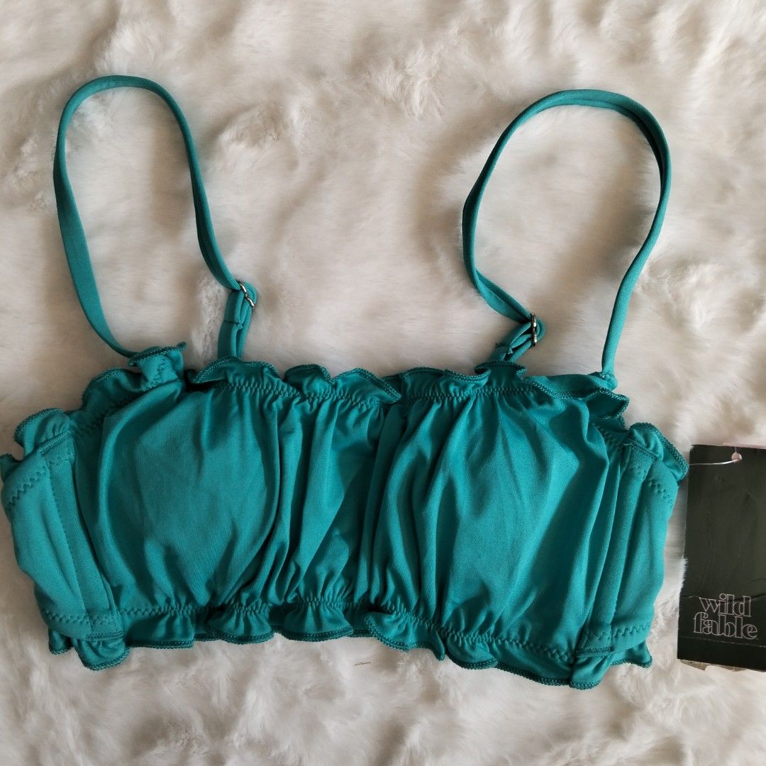 Wild Fable Ruffle Bikini Top XS (Category: Bikinis & Swimsuits) located in Quezon City. Submitted by heybailey (Listing ID 1424435981, Image 1). Description: - Wild Fable bikini top - Vibrant teal color - Ruffle design - Adjustable straps - Clasp closure - Size: XS - Made in Vietnam.