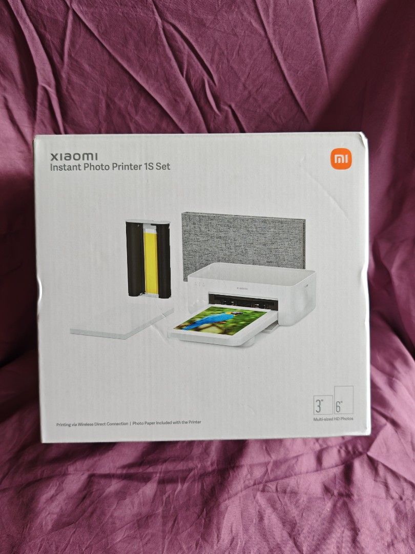 Xiaomi Instant Photo Printer 1S Set (Category: Printers, Scanners & Copiers) located in Quezon City. Submitted by farsiren06 (Listing ID 1424497362, Image 1). Description: Xiaomi Instant Photo Printer 1S Set. It includes the printer, photo paper, and a photo album with 50 pages. Also included are a charging cable and other accessories. The printer is white and comes with a gray photo album. -Open box na po sya kasi chineck ko lang po yung laman. 