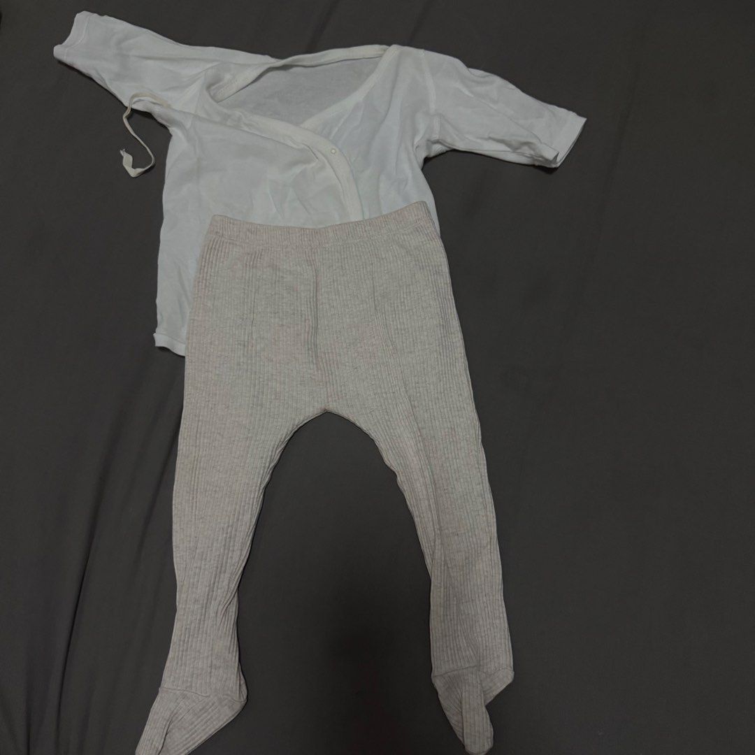 Zara Baby Clothes Set (Category: Babies & Kids Fashion) located in Cavite. Submitted by jomspreloved (Listing ID 1424461404, Image 1). Description: Zara baby clothes set. Includes a white long-sleeved wrap top and beige ribbed pants with feet. Comfortable and stylish for your little one..