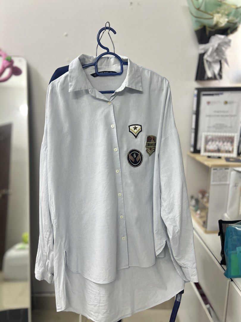 Zara Basic Patch Shirt (Category: Shirts) located in Kuala Lumpur. Submitted by qidddx (Listing ID 1424345613, Image 3). Description: - Zara Basic shirt - Light blue color - Patch details on front and sleeve - Long sleeves - Size M - Made in Morocco.