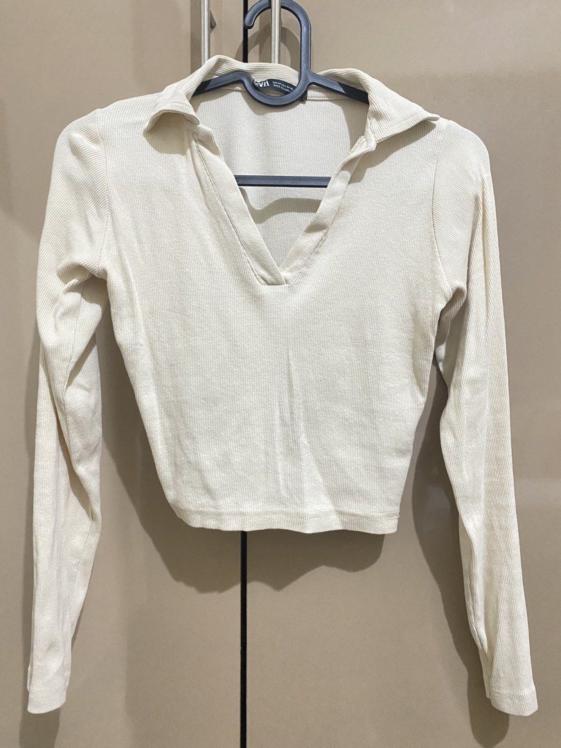 Zara Ribbed Polo Top (Light Cream) (Category: Blouses) located in Taguig. Submitted by jaebae_ (Listing ID 1424444282, Image 1). Description: - Zara cream ribbed polo top - Collared neckline - Long sleeves - Cropped style - Size M (can fit to S-M body frame) - Made in Bangladesh.