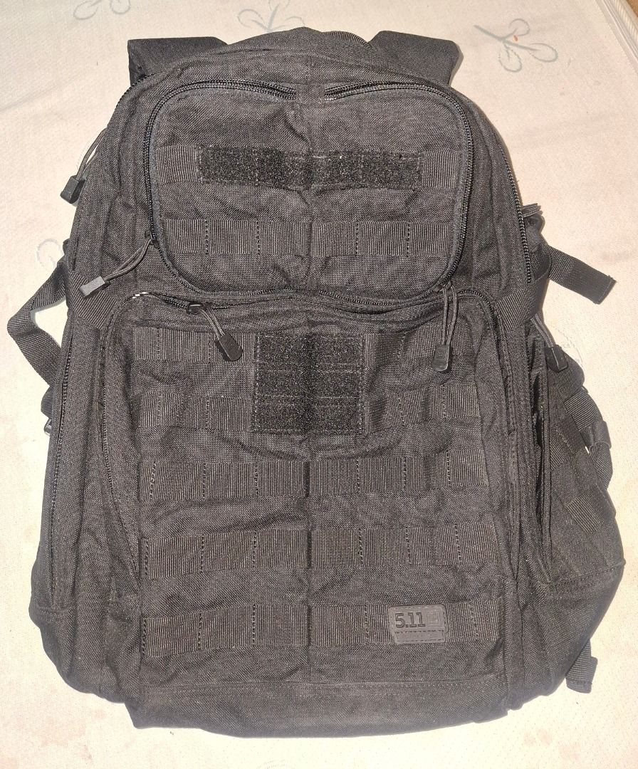 5.11 RUSH® 24 2.0 Backpack 37L (Category: Backpacks) located in Quezon City. Submitted by sagejiro0216 (Listing ID 1429283788, Image 1). Description: RUSH® 24 2.0 Backpack 37L Durable black backpack from 5.11 Tactical. Features multiple compartments and MOLLE webbing for attaching additional gear. Includes adjustable shoulder straps and a top carry handle. The front has a velcro patch area for attaching patches. The 5.11 logo is visible on the fr
