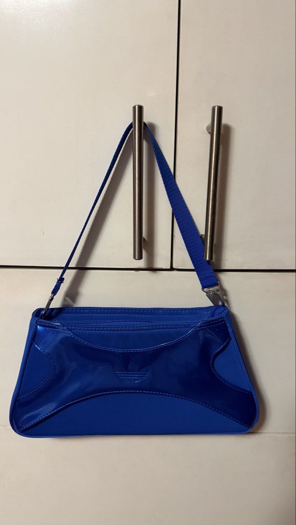 Adidas Clutch Shoulder Bag Blue (Category: Shoulder Bags) located in Makati City. Submitted by mega_manila (Listing ID 1429276899, Image 2). Description: never been used RFS: gift but not my style.