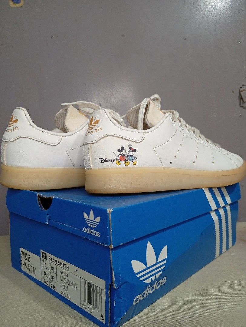Adidas Stan Smith Disney Mickey Mouse Sneakers (Category: Babies & Kids Fashion) located in Makati City. Submitted by vians2002 (Listing ID 1429169312, Image 1). Description: Adidas Stan Smith sneakers featuring a Disney Mickey Mouse design. The sneakers are white with a tan sole. The size is US 6, UK 5.5, and EUR 38. The box is included. The model number is GW2255. The original price is PHP 4,800.00..