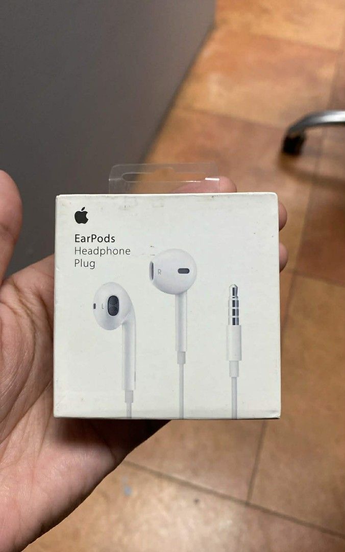 Apple EarPods with 3.5mm Headphone Plug (Category: Earphones) located in Manila. Submitted by milasgadgetph (Listing ID 1429333432, Image 1). Description: EarPods with a 3.5mm headphone plug. The earphones are white and come in their original packaging. The box features the Apple logo and the product name. These are designed for a comfortable fit and deliver clear audio. Perfect for listening to music or taking calls..