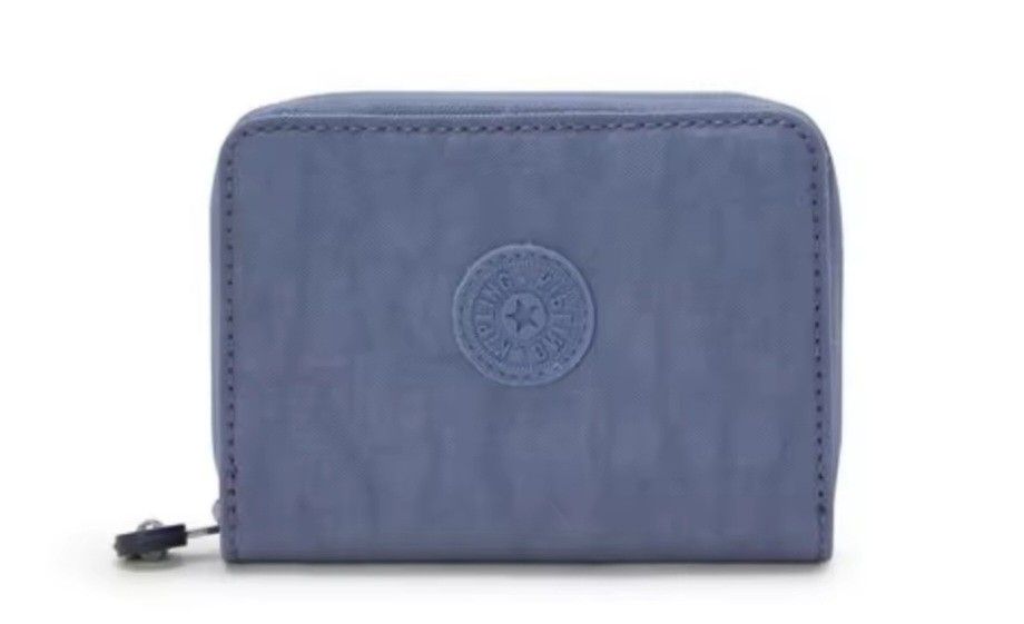 Authentic Kipling Money Love Wallet Ocean Blue (Category: Wallets & Card holders) located in Davao. Submitted by jilly07 (Listing ID 1429334852, Image 1). Description: Kipling wallet features a zip-around closure and multiple compartments for cards and cash. It has a clear ID window and a snap closure. The wallet is made of a durable, textured material and includes the Kipling logo. Used only ONCE. GOOD as NEW. In EXCELLENT condition. Comes with 