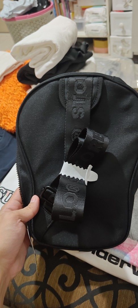 BAPE baby milo Sling cross bag (Category: Luxury Bags & Wallets) located in Manila. Submitted by sik2find (Listing ID 1429272518, Image 3). Description: BRANDNEW AUTHENTIC CROSS BODY BAG Black BAPE shoulder bag featuring the iconic ape head design. Includes a detachable banana charm and a branded strap. The bag has a zippered main compartment and an interior pocket. The bag is new with tags..