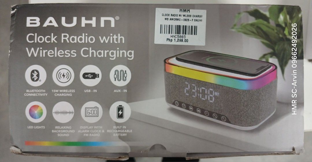 BAUHN Clock Radio with Wireless Charging (Category: Clocks) located in Manila. Submitted by sc_arvin (Listing ID 1429215651, Image 1). Description: BAUHN clock radio features wireless charging, Bluetooth connectivity, and LED lights. It also includes a display with alarm clock and FM radio functionality. It has USB and AUX-in ports, and a built-in rechargeable battery. The clock displays the time as 23:08..
