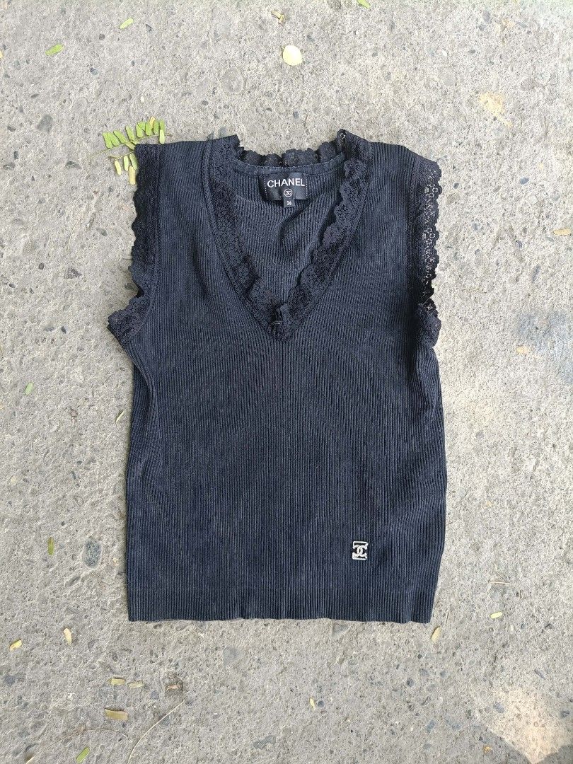 Chanel Black Ribbed Top with Lace Trim (Category: Sleeveless) located in Iloilo. Submitted by singkomils.ilo5000 (Listing ID 1429220542, Image 1). Description: Chanel Size 36 Excellent condition iloilo City 1k.