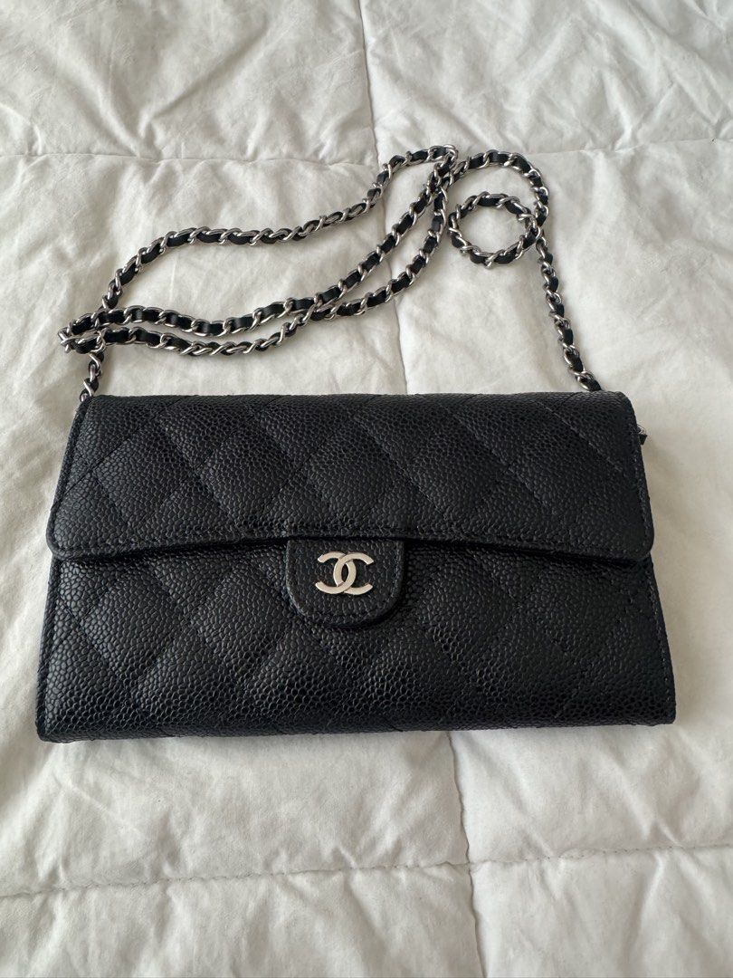 Chanel Wallet on Chain Black Caviar Leather (Category: Luxury Bags & Wallets) located in Makati City. Submitted by carlysd (Listing ID 1429177830, Image 2). Description: Elegant Chanel Wallet on Chain in black caviar leather. Features a classic quilted design with a silver-tone chain strap and the iconic CC logo on the front. The bag has a flap closure. Perfect for carrying essentials in style. A timeless piece that complements any outfit..