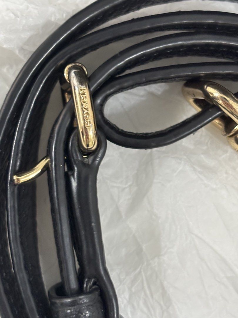 Coach Black Leather Handbag with Shoulder Strap (Category: Luxury Bags & Wallets) located in Quezon City. Submitted by pamelajoyc07797 (Listing ID 1429232040, Image 2). Description: Black Coach handbag with a top handle and a detachable shoulder strap. gold-tone Coach logo on the front. Includes a matching black shoulder strap with gold hardware. The interior color is brown. •crossgrain/pebbled leather •top zip closure •double handles. Detachable