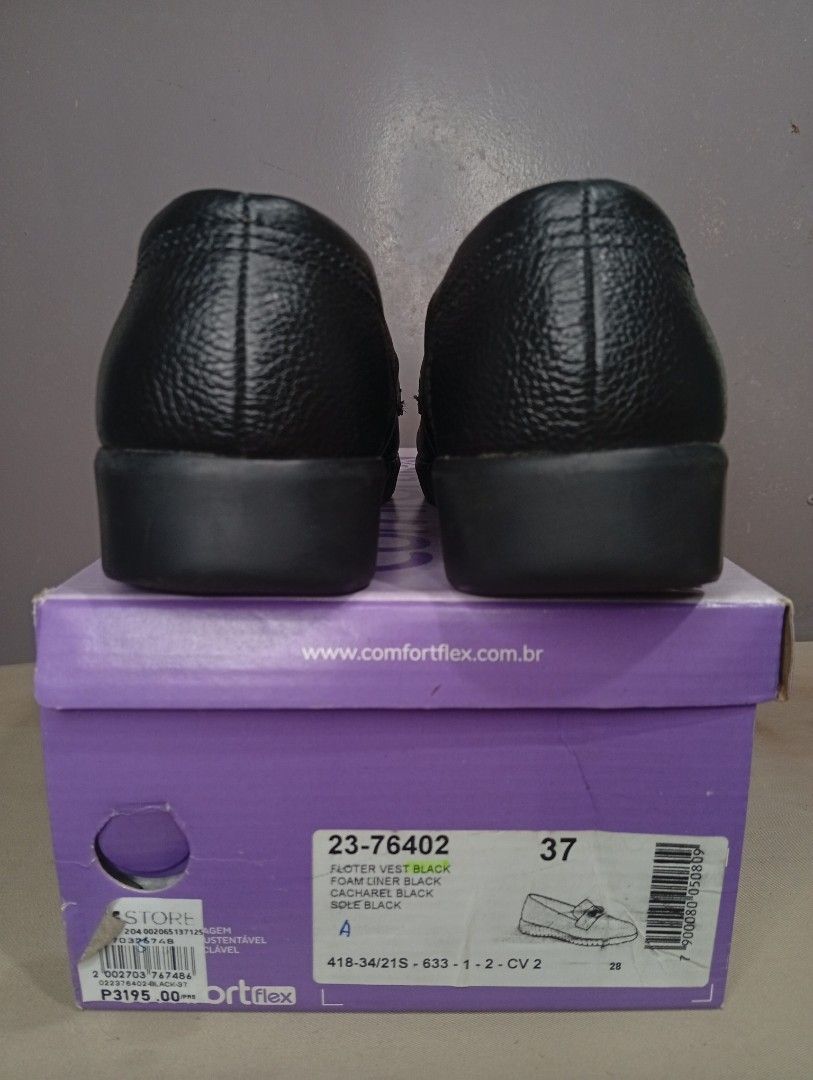 Comfortflex Black Loafers Size 37 (Category: Loafers) located in Makati City. Submitted by vians2002 (Listing ID 1429171460, Image 2). Description: Comfortflex black loafers. Features a textured upper and a decorative buckle. The shoes have a cushioned insole and a ridged sole for added grip. The size is 37. The shoes come with their original box..