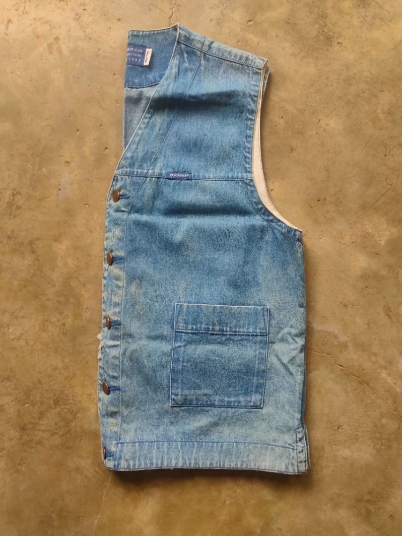 Vintage Dickies Workwear Denim Vest (Category: Vests) located in Baguio. Submitted by pormado (Listing ID 1429308574, Image 3). Description: Vintage Dickies denim vest. Features a button-up front, two front pockets, and a V-neck design. The vest has a light blue wash and a Dickies logo patch. The size tag indicates it is a size L. The vest has a classic, timeless style. Very Good Condition Width: 22 Length: 25 Color Rate 8/10 Size M-L Signs of Us