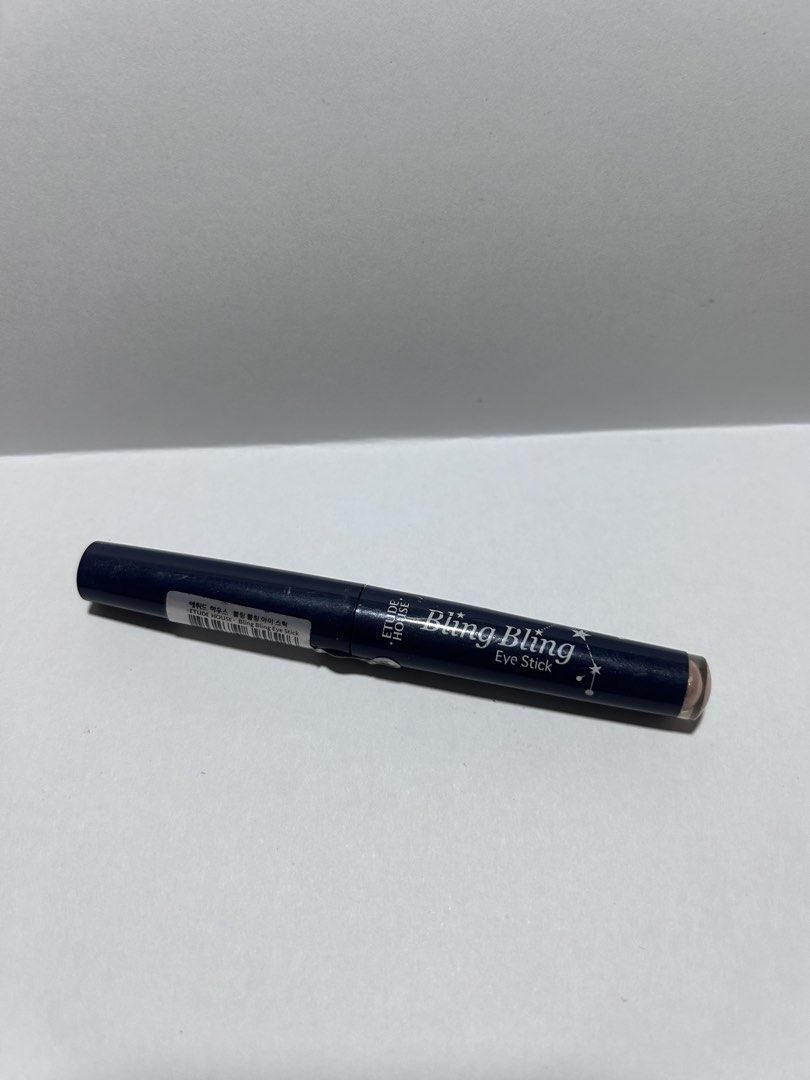 Etude House Bling Bling Eye Stick (Category: Makeup) located in Binan City. Submitted by adressmnl (Listing ID 1429204585, Image 1). Description: Etude House Bling Bling Eye Stick. The eye shadow stick is a shimmery, light pink color. The product is in a dark blue tube with the brand name and product name printed on it. The cap is black. Rarely used.