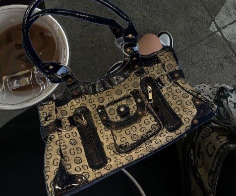Guess Handbag - Vintage - Black - Y2K (Category: Luxury Bags & Wallets) located in Plaridel. Submitted by wanderer444 (Listing ID 1429324351, Image 1). Description: rfs: decluttering + need funds pics posted sa listing is what it really looks like w/ the issues issues : •tear/worn out fabric - right side and bottom right sa likod (pic is posted po) •small zip pouch inside the bag has no zipper and has a tear bought it here sa carousell .