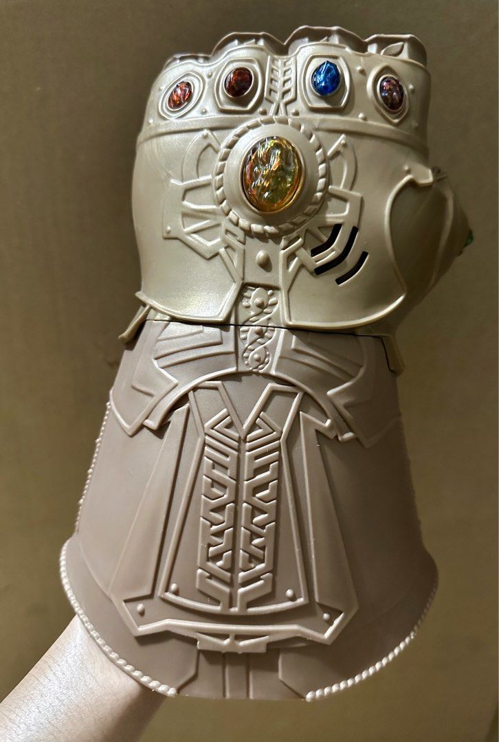 Thanos Infinity Gauntlet (Category: Figurines & Statues) located in Binan City. Submitted by elf.0000 (Listing ID 1429288870, Image 1). Description: Hasbro Marvel Avengers Infinity Gauntlet. It features the iconic design with the Infinity Stones. The gauntlet is made in China and has the Marvel 2017 copyright. Battery operated, working condition P900.00 plus sf Woth some discoloration or scratches Payment via gcash Ship thru j&t.
