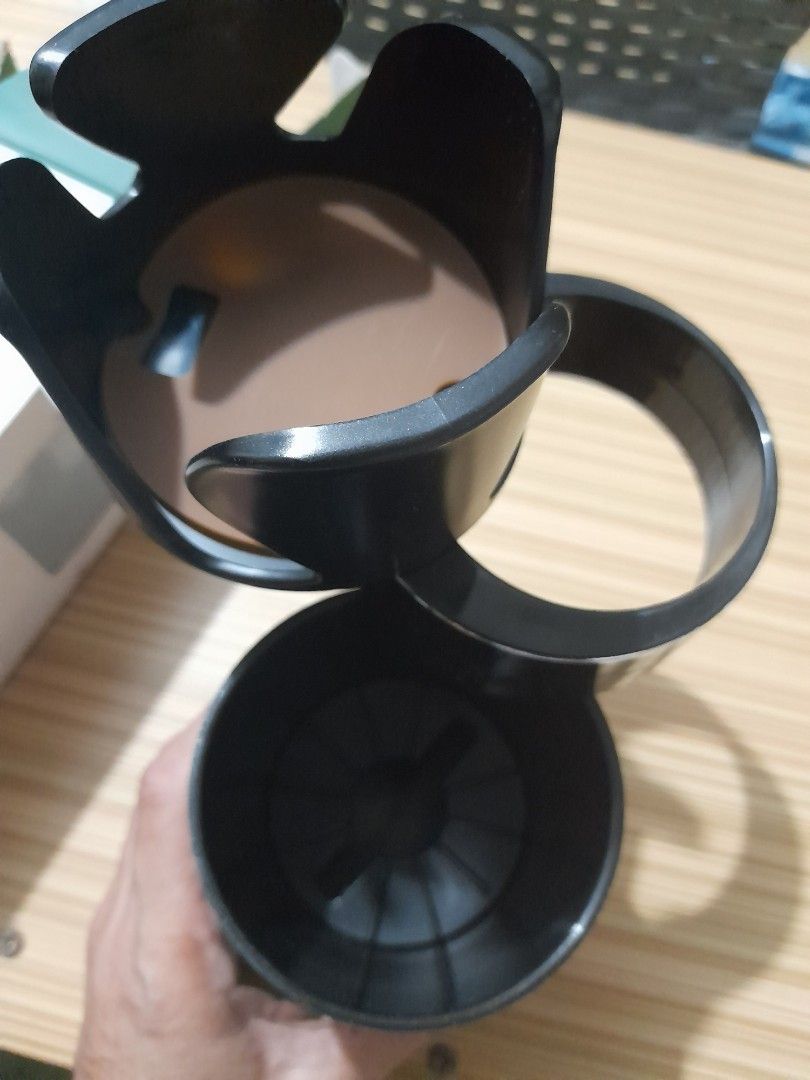 Joy Tech Multi Cups Auto Cup Case (Category: Coffee & Tea Tableware) located in Bocaue. Submitted by marajapansurplus (Listing ID 1429168073, Image 3). Description: Multi Cups auto cup case from Joy Tech. The cup case is black with a brown base and a silver accent. The box indicates it is a cup case. It has a multi-cup design..