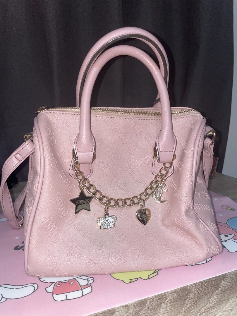 Juicy Couture Pink Satchel Bag (Category: Cross-body Bags) located in Quezon City. Submitted by lukajaeger (Listing ID 1429288442, Image 1). Description: Original Juicy Couture Eastside Westside Satchel -2 pockets on the inside (see picture for reference) -lightly used -has an adjustable strap, smallest possible length is roughly around 20 inches -bought from the us -tag included.