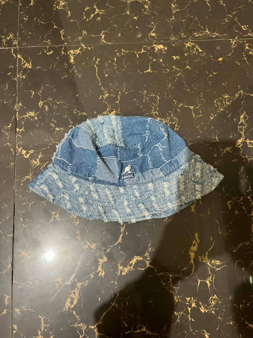 Kangol Denim Bucket Hat (Category: Caps & Hats) located in Manila. Submitted by dre.yuithero (Listing ID 1429266279, Image 1). Description: Kangol bucket hat is made of denim. It features a patchwork design and a Kangol logo. The hat is a medium size. It has a blue color. The hat is perfect for adding a touch of style to any outfit..