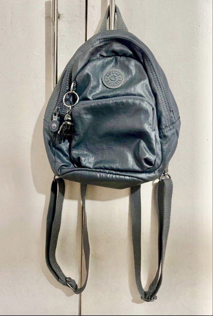 Kipling Glayla Mini Backpack - Metallic Gray (Category: Backpacks) located in Rizal. Submitted by justtashi (Listing ID 1429260124, Image 1). Description: Kipling Glayla mini backpack. The Glayla is a compact, lightweight bag known for its convertible design, often featuring two adjustable straps that allow it to be worn as both a backpack and a crossbody bag. Key Features Material: Typically 100% Polyamide with a water-repellent finish. Storage: