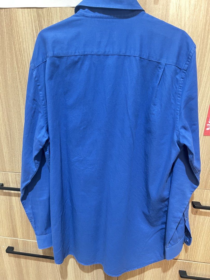 Lacoste Regular Fit Long Sleeve Shirt (Category: Tshirts & Polo Shirts ) located in Manila. Submitted by jandp_ph (Listing ID 1429230928, Image 2). Description: - Classic Lacoste long sleeve shirt in a vibrant blue. - The shirt has a button-down front and cuffs. - Size FR 41 and US 16..