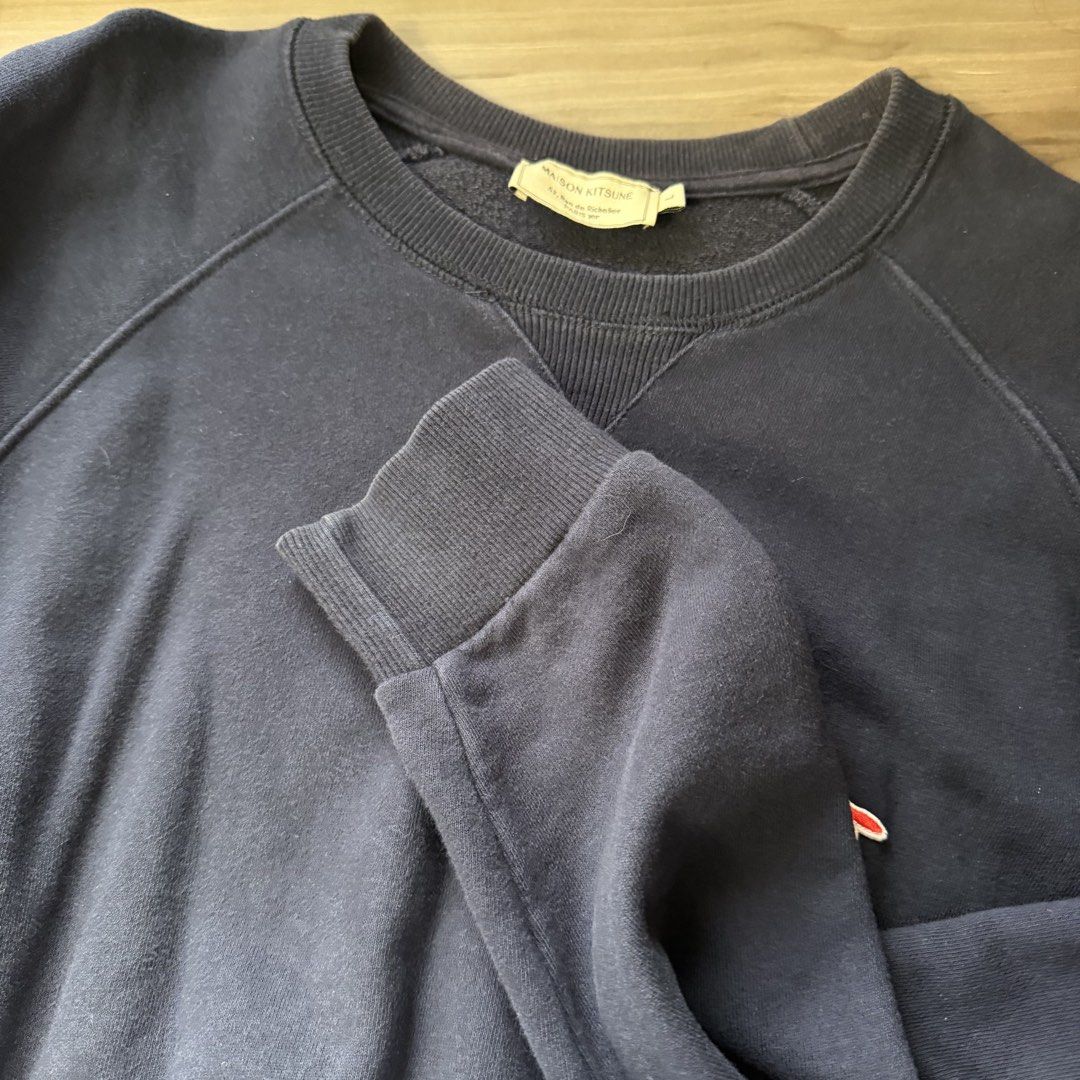Maison Kitsune Navy Sweatshirt (Category: Coats, Jackets and Outerwear) located in Quezon City. Submitted by andreasclothes (Listing ID 1429252472, Image 3). Description: Navy blue. 52 x 63 cm Guaranteed authentic Good condition but fading na at the back part Negotiable Retails for around 13k.