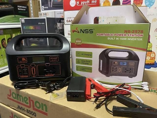 NSS NS-2578 Portable Power Station (Category: Electrical, Adaptors & Sockets) located in Manila. Submitted by nikkoshop (Listing ID 1429240946, Image 2). Description: NSS NS-2578 Portable Power Station with a built-in 150W inverter. It features AC charging, solar panel charging, and a built-in LED light with three modes. Compatible with various devices like phones, tablets, and laptops. Includes a solar charging kit and accessories. Model: NS-A20
