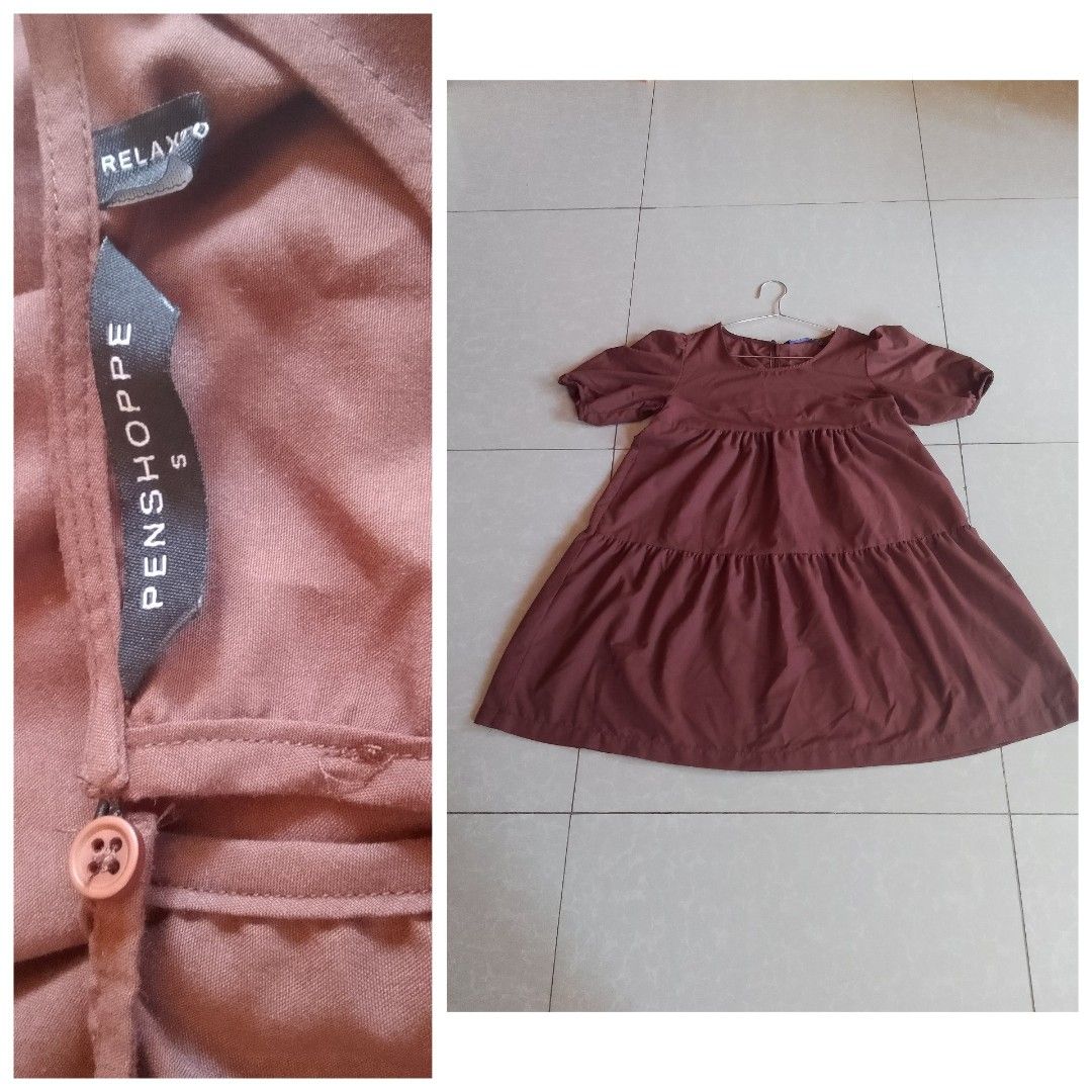Penshoppe Tiered Dress (Category: Dresses) located in Davao. Submitted by declutter-ecothings (Listing ID 1429182795, Image 1). Description: Brown tiered dress from Penshoppe. Features short sleeves and a round neckline. Made of 100% cotton. Size S. Made in the Philippines. The dress has a relaxed fit and a button detail. In puff sleeve. .