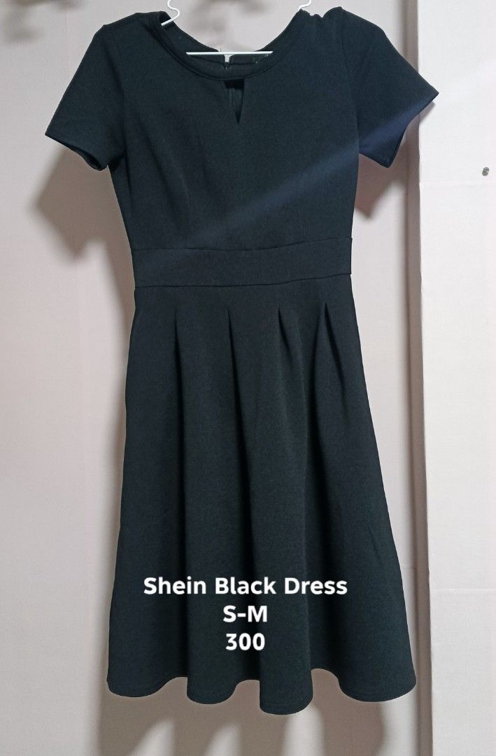 Shein Black Dress S-M (Category: Dresses) located in Manila. Submitted by mightytree.ce1437 (Listing ID 1429208068, Image 1). Description: Elegant black dress from Shein. Features a flattering fit-and-flare silhouette with a V-neckline and short sleeves. The dress has a fitted waist and pleated skirt, creating a classic and versatile look. Perfect for various occasions, from casual outings to semi-formal events. Size S-M..