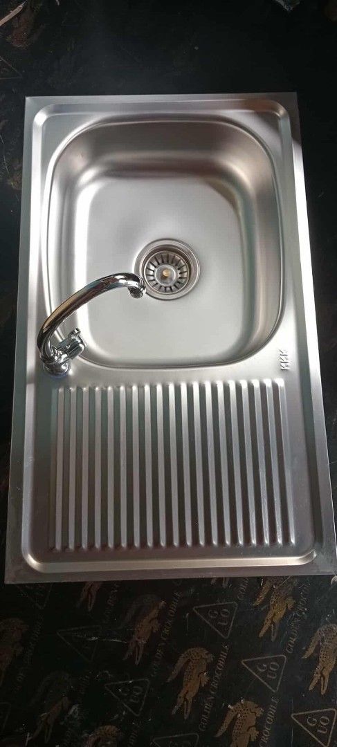 Stainless Steel Kitchen Sink with Drainboard (Category: Bathroom & Kitchen Fixtures) located in Manila. Submitted by muranglababo_ph2026 (Listing ID 1429179706, Image 2). Description: Murang stainless lababo with drainboard “Matibay at Malinis na Stainless Lababo – Murang Deal!” 📋 Description: For sale: Pre-loved stainless steel lababo. ✔ Malinis at maayos ang kondisyon ✔ Matibay at walang tagas ✔ Ready to install – swak sa kusina o laundry area