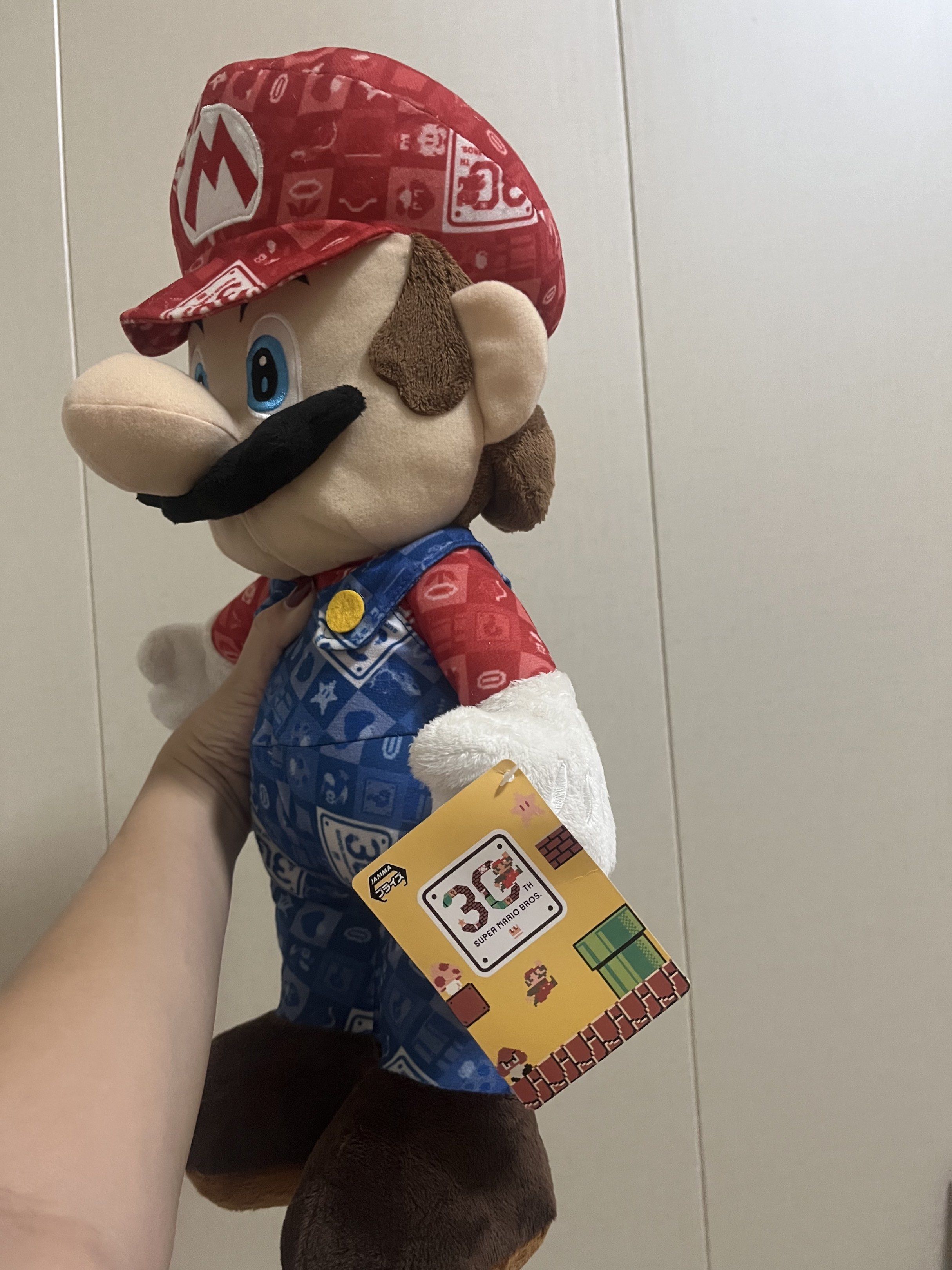 Super Mario 30th Anniversary Plush Toy (Category: Plushies & Soft Toys) located in Las Pinas. Submitted by stuffhaven (Listing ID 1429327691, Image 2). Description: Location : Las Piñas Pick up or lalamove Jnt (Wednesday and Saturday only) -Super Mario 30th anniversary. -It features Mario in his 30th Anniversary outfit including a red cap with the 'M' logo. -With pen mark on face (kindly check picture) -The plush has a tag attached. It would be a