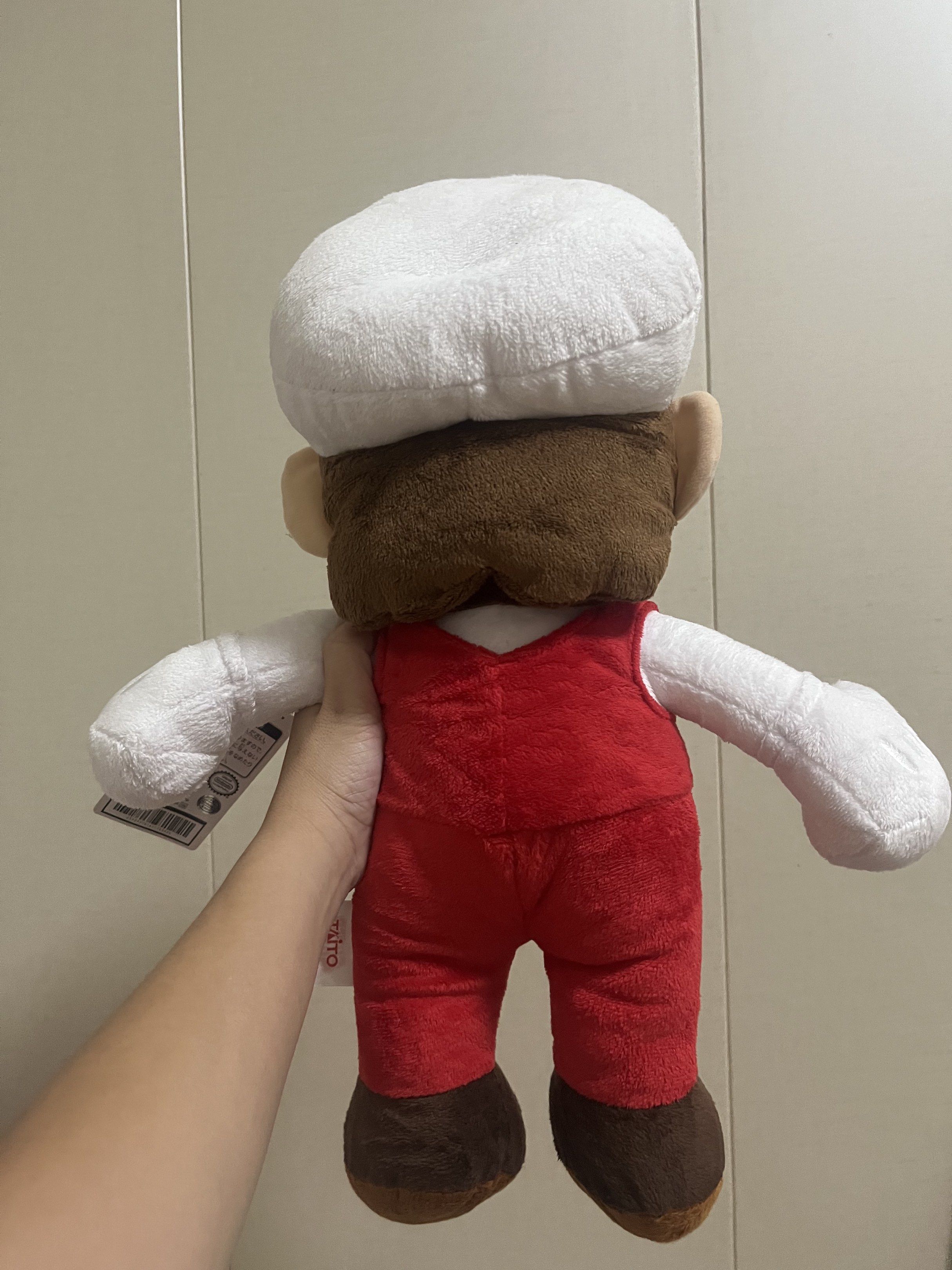 Super Mario Fire Mario Plush Toy (Category: Plushies & Soft Toys) located in Las Pinas. Submitted by stuffhaven (Listing ID 1429327746, Image 3). Description: Location : Las Piñas Pick up or lalamove Jnt (Wednesday and Saturday only) -Super Mario plush toy features Fire Mario in his iconic outfit. -It has a white cap with the 'M' logo, a red jumpsuit, and brown shoes. The toy has a tag attached. It is licensed by Nintendo..
