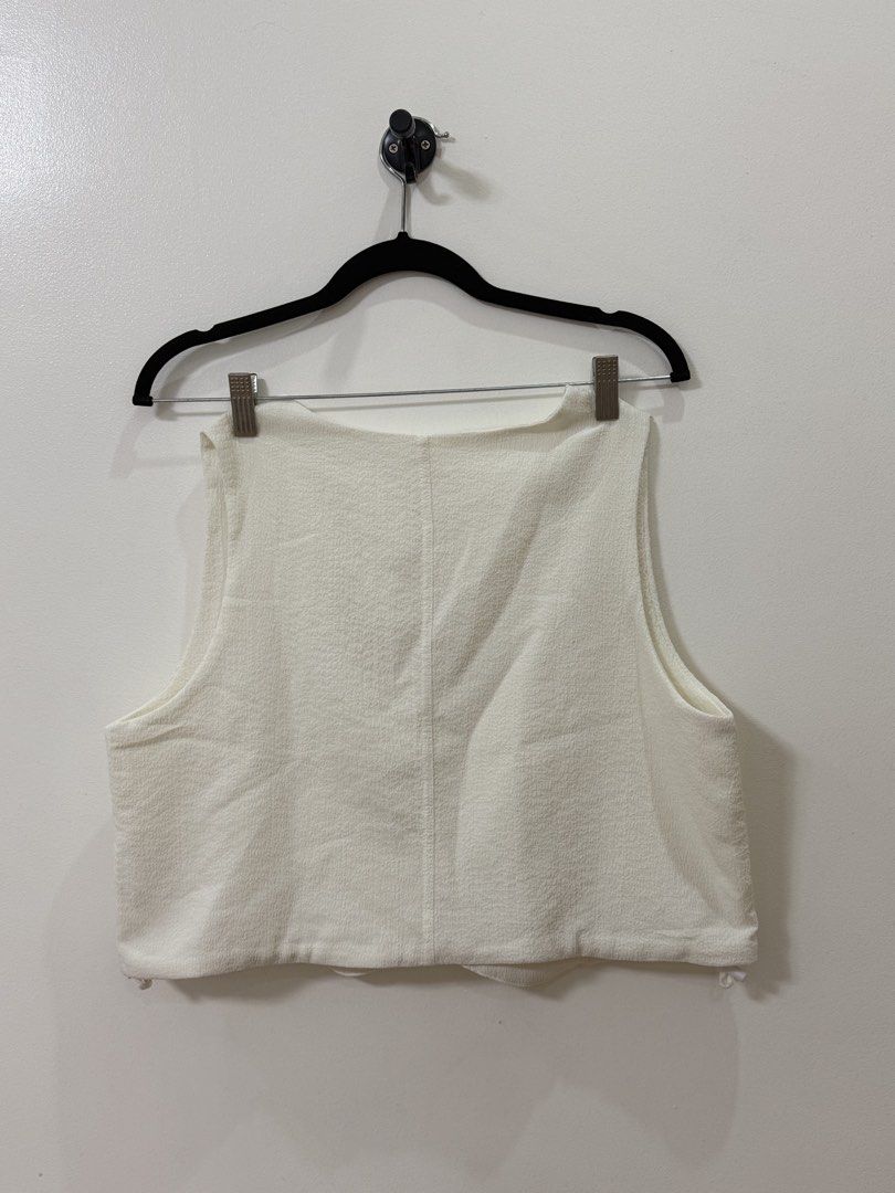 The Paper Bunny White Button-Up Vest (Category: Blouses) located in Pasay City. Submitted by mcsanmig (Listing ID 1429214475, Image 2). Description: Bought at TPB Singapore Rfs: Not using anymore Original Price ₱2,000.