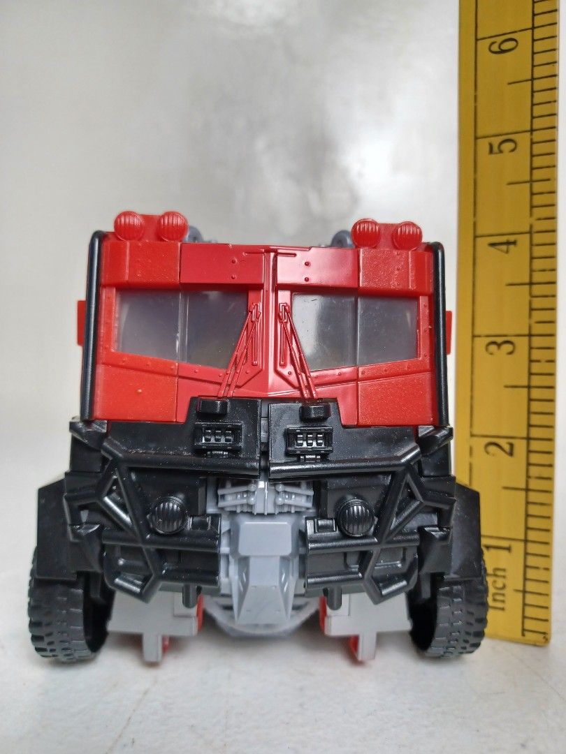 Transformers ROTB Beast-Mode Optimus Prime (Category: Action & Battle Toys) located in Baguio. Submitted by restyrille77846 (Listing ID 1429285682, Image 1). Description: Transformers ROTB Beast-Mode Optimus Prime action figure. It transforms from a truck to a robot. The figure is red and blue with black wheels. The figure is approximately 8 inches long..