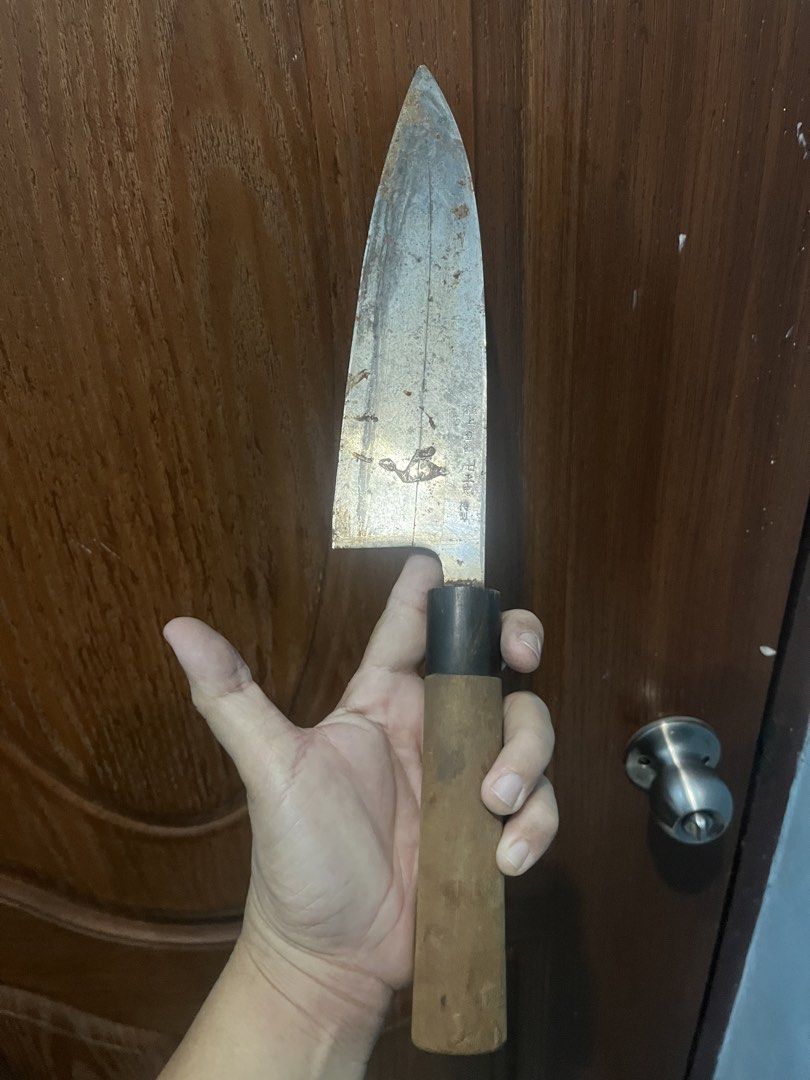 Vintage Japanese Deba Knife. (Category: Knives & Chopping Boards) located in Pasay City. Submitted by beye01 (Listing ID 1429221235, Image 2). Description: Vintage Japanese knife with a wooden handle. The handle is made of wood and has a dark collar. The blade has some markings on it. It is a used item. Blade is about 20cm and handle is about 14cm. Please check out my other items for sale. Thank you..