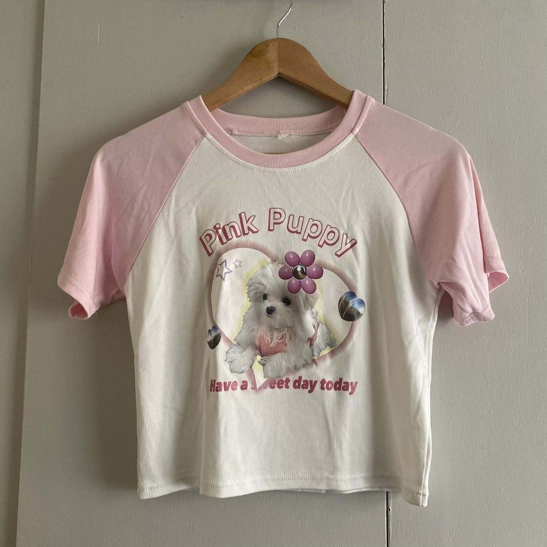 Y2K Cute Pink Puppy Graphic Tee (Category: Shirts) located in Manila. Submitted by cznclae (Listing ID 1429261627, Image 1). Description: best fit for size Small- Medium Bust: Length: Heat Press vinyl print ❔issue: minimal dot dirt, not sure if washable sf mm & luzon 41 pesos if not rush via jnt 🗓️ check bio for next shipment sched PLEASE READ! ❗️PAYMENT FIRST via g/cash or Pabili service 🛒how to buy? make an offer, then send details for SF quo