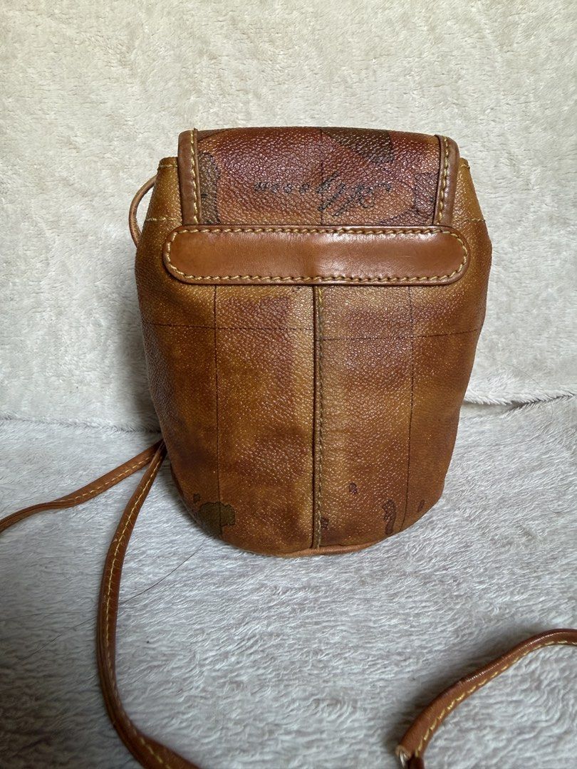 Alviero Martini Geo Map Crossbody Bag (Category: Luxury Bags & Wallets) located in Naga. Submitted by shieshop (Listing ID 1429348373, Image 2). Description: Original Micro bucket bag Alviero Martini Sign of usage Sling needs repair Rare.