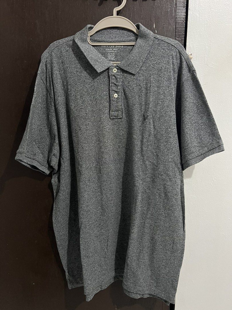 American Eagle Super Soft Polo Shirt XL (Category: Tshirts & Polo Shirts ) located in Manila. Submitted by ohno_shimi (Listing ID 1429455874, Image 2). Description: American Eagle Super Soft polo shirt in gray. Made in India. Features a standard fit and is size XL/TG/EXG. Made of 100% cotton. Has a three-button placket and short sleeves. The shirt has a Real Good tag. Machine washable..